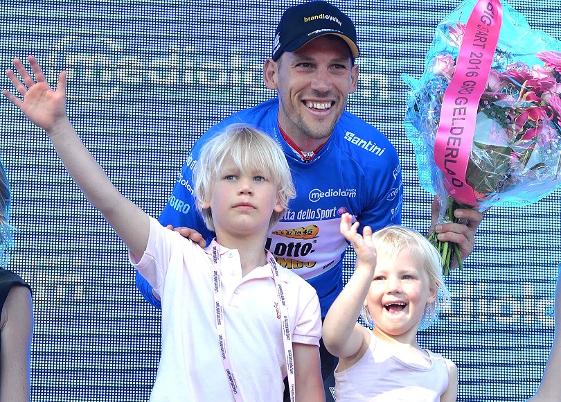 Dutch rider Maarten Tjallingii of the team Lotto Nl Jumbo wears the overall Blu jersey as he celebrates with his son on the podium after the third stage of the Giro d'Italia cycling race over 190km between Nijmegen and Arnhem, Netherlands, 08 May 2016. ANSA/LUCA ZENNARO